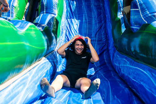 Student at the bottom of an inflatable slide.