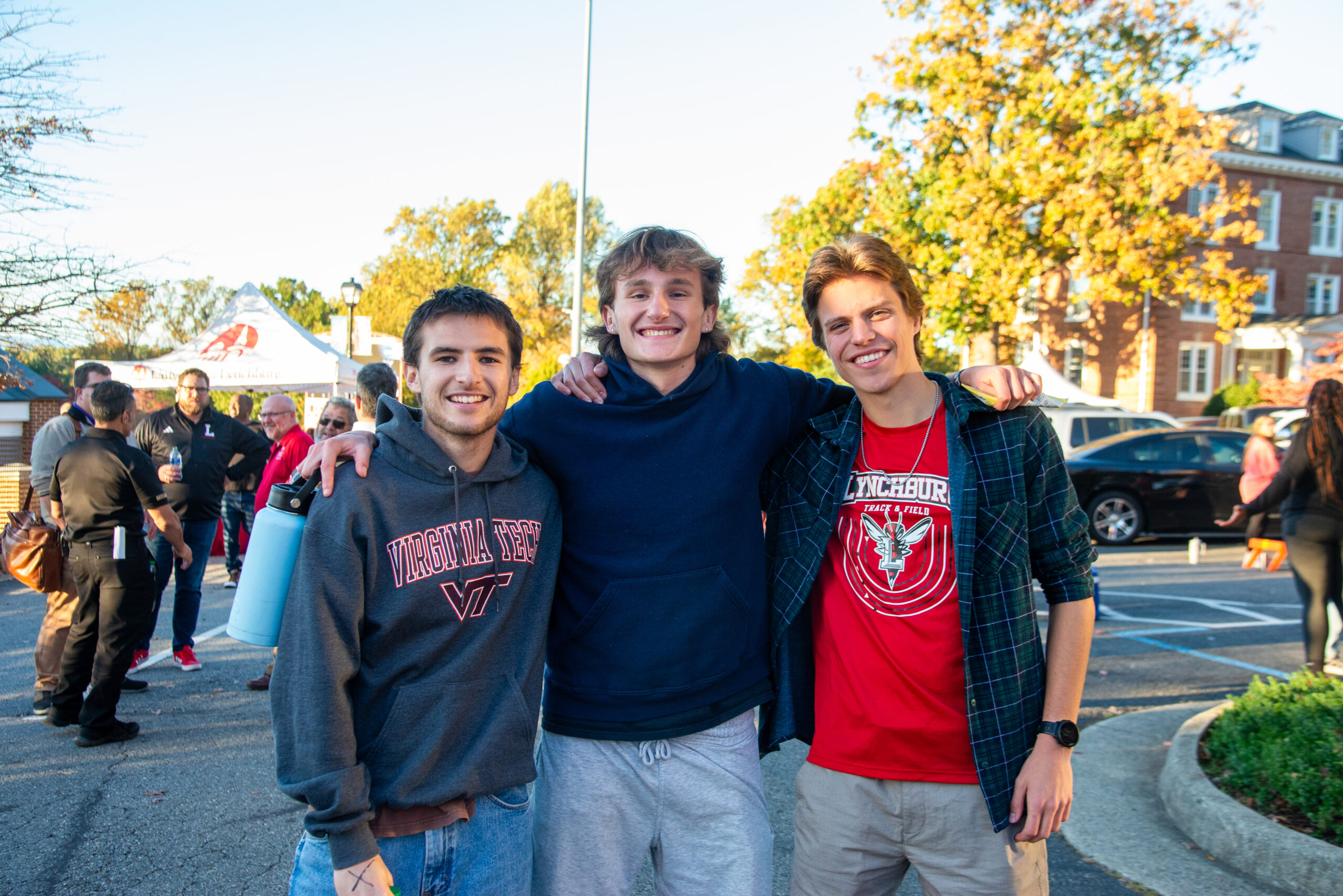 Three guys hug during a photo